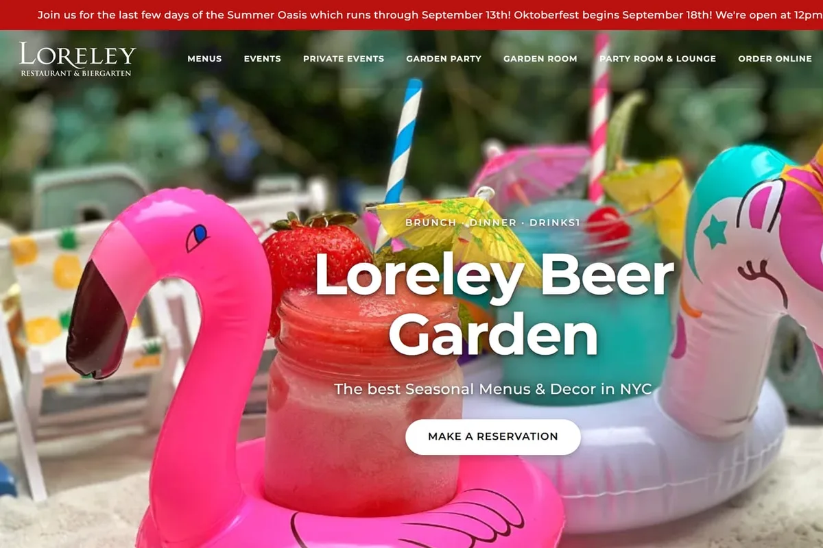 The top of Loreley Beer Garden's homepage, with a Make a reservation button over a photo of frozen drinks in pool floats