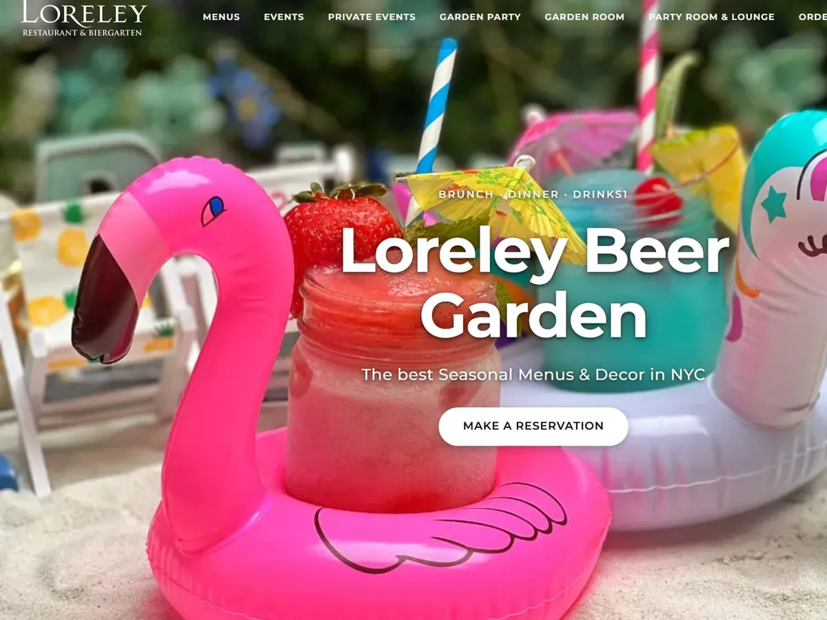 The homepage of Loreley Beer Garden's website, with a Make a Reservation button over frozen drinks in pool floats