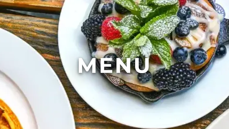 The top of Loreley Beer Garden's menu page on a phone, with brunch plates and drinks photographed from above under the word Menu